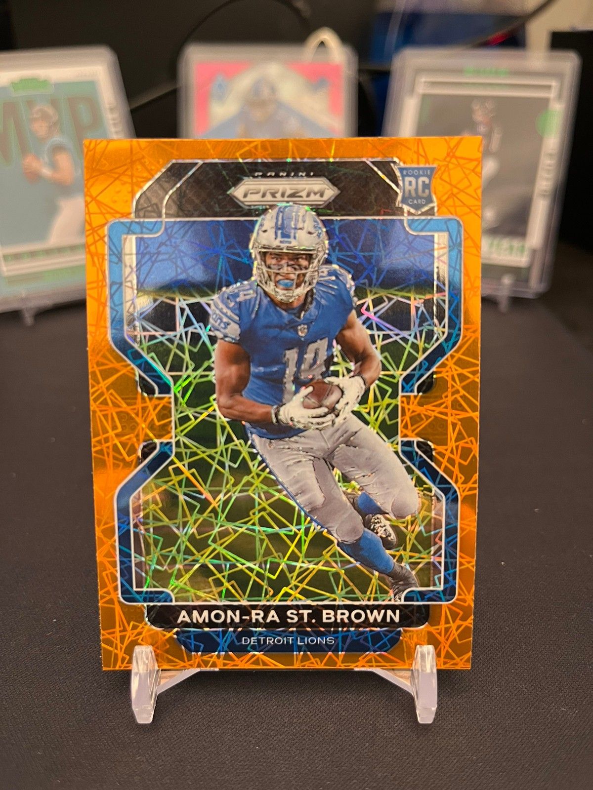 Amon-Ra St. Brown 2021 Panini Prizm Orange Laser Prizm Rookie Card