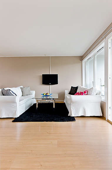 Stuen er malt i delikate farger. Galleribilde