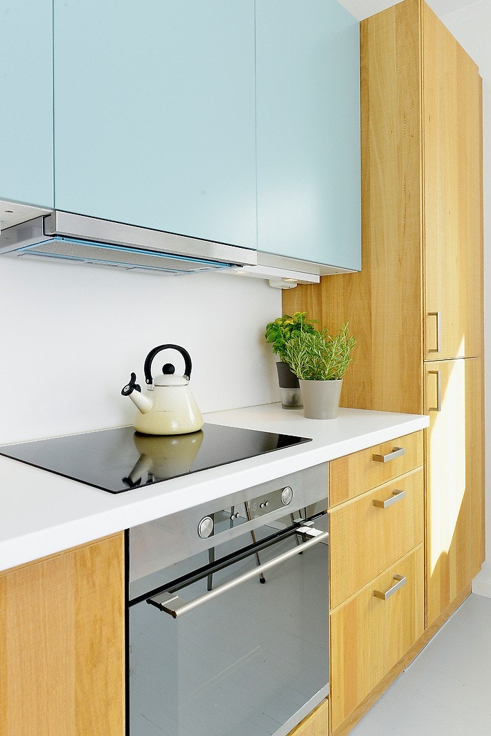 Pent kjøkken med integrerte hvitevarer Galleribilde