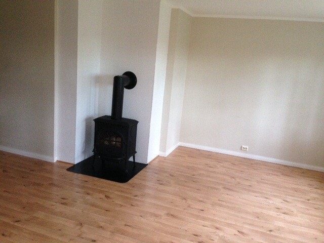 Stue med ved ovn Galleribilde