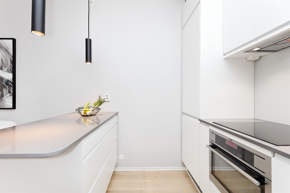 Eksklusiv Designa kjøkkeninnredning med integrerte hvitevarer i høy kvalitet Galleribilde