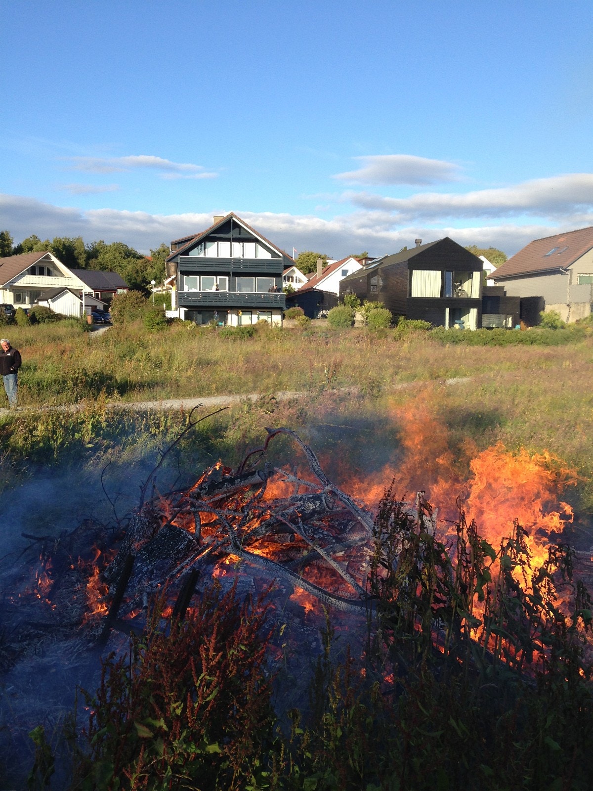 Midsummer neighbourhood bonfire in front of the house Galleribilde