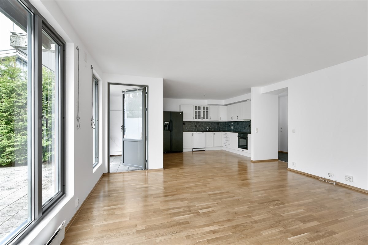Leiligheten har en meget stor åpen stue/kjøkkenløsning. Galleribilde