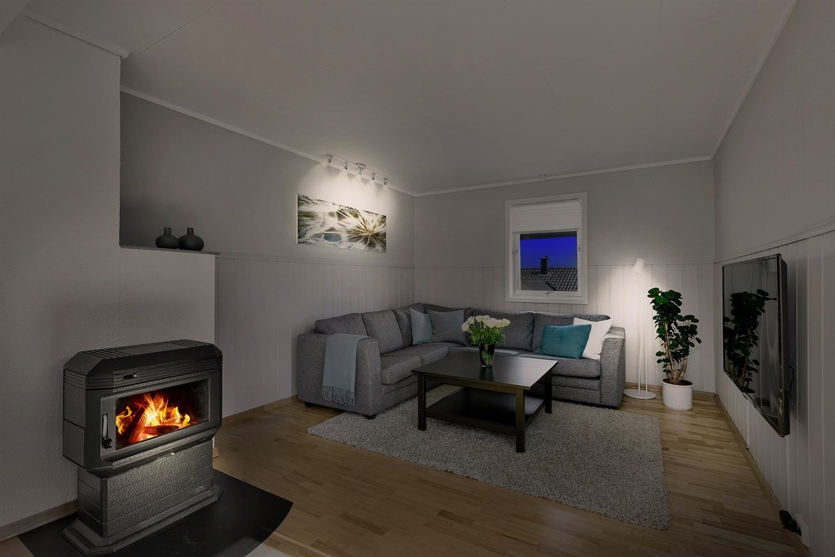 Stuen har en stemningsfull peisovn sørger for ekstra varme og hygge. Galleribilde