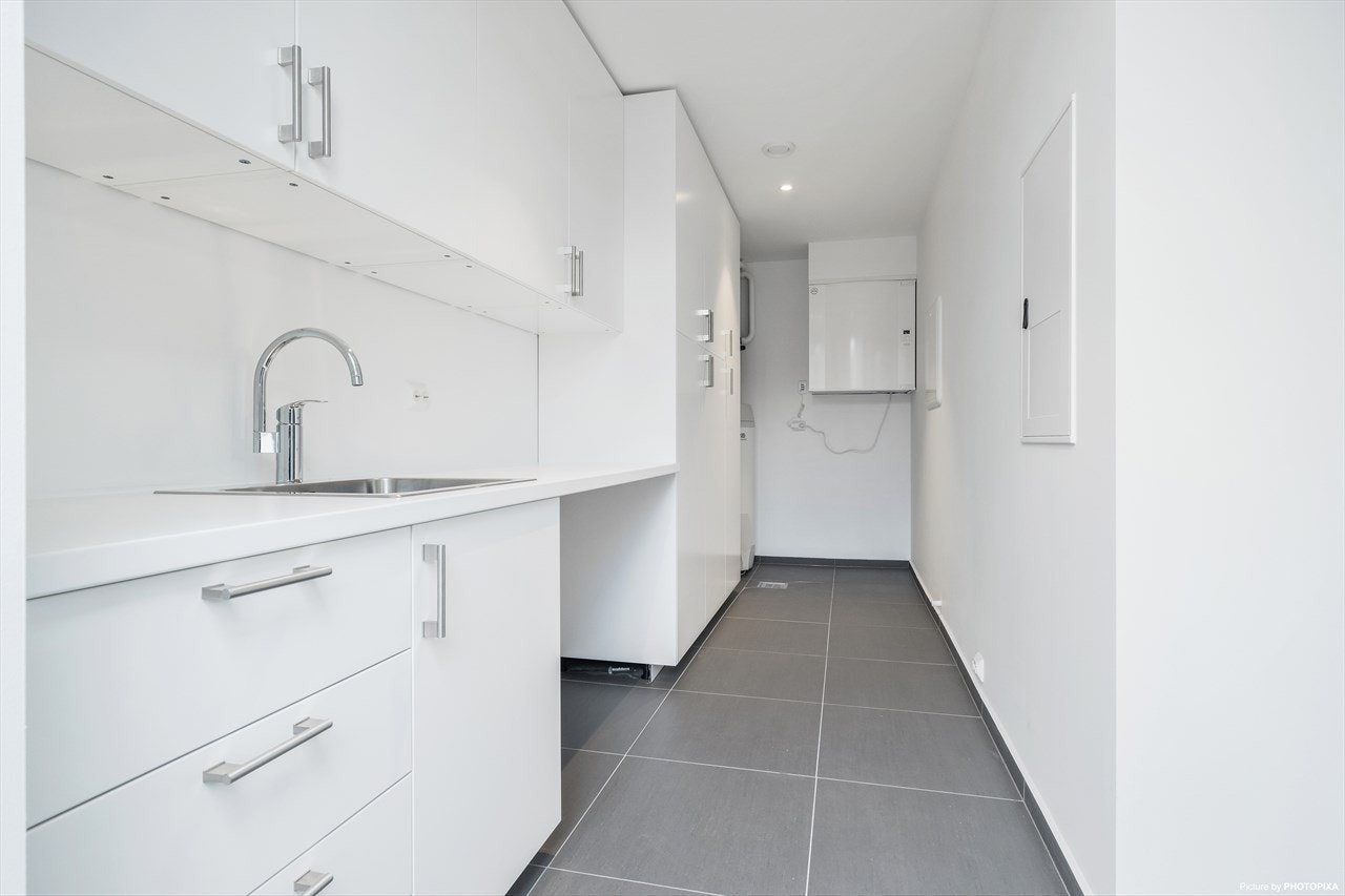 Praktisk biinngang og vaskerom i ett. Galleribilde