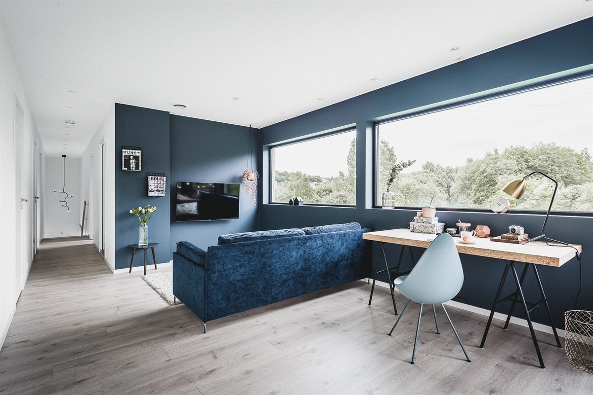 I andre etasje finner du ytterligere en sosial sone, i form av en stue på nesten 28 kvadratmeter. Galleribilde