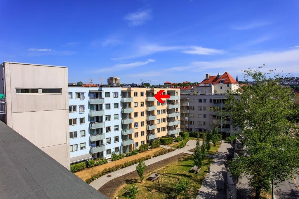 Leiligheten er markert med rød pil. Galleribilde