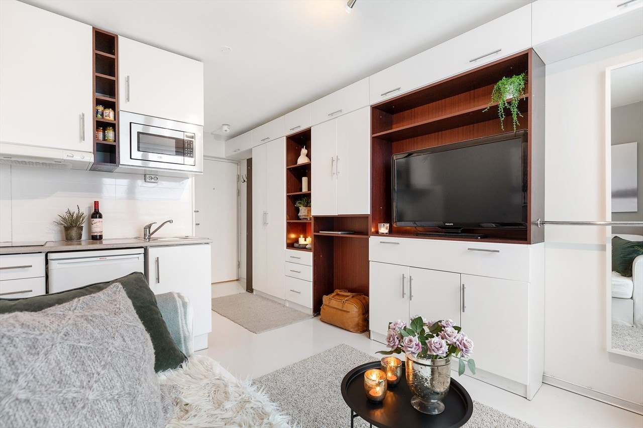 Leiligheten har optimal utnyttelse av areal med sin åpne stue og kjøkkenløsning. Galleribilde