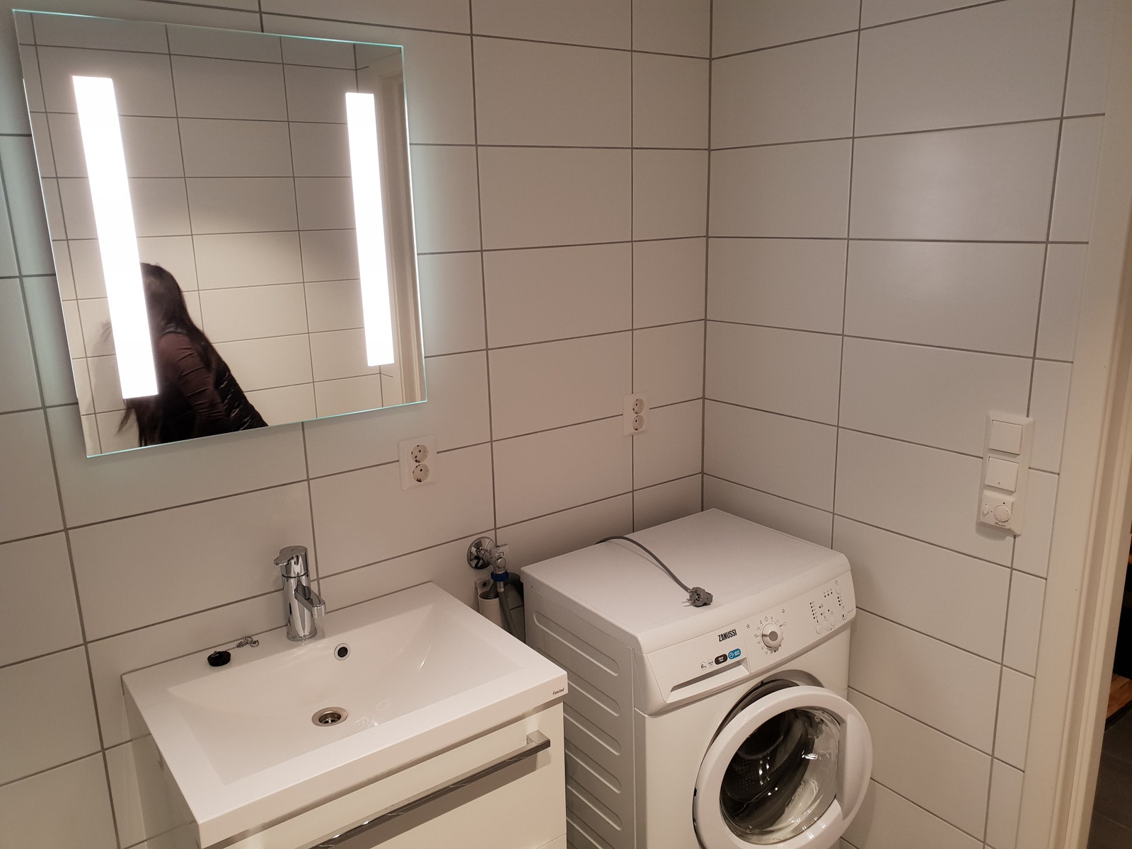 Bad med vaskemaskin Galleribilde
