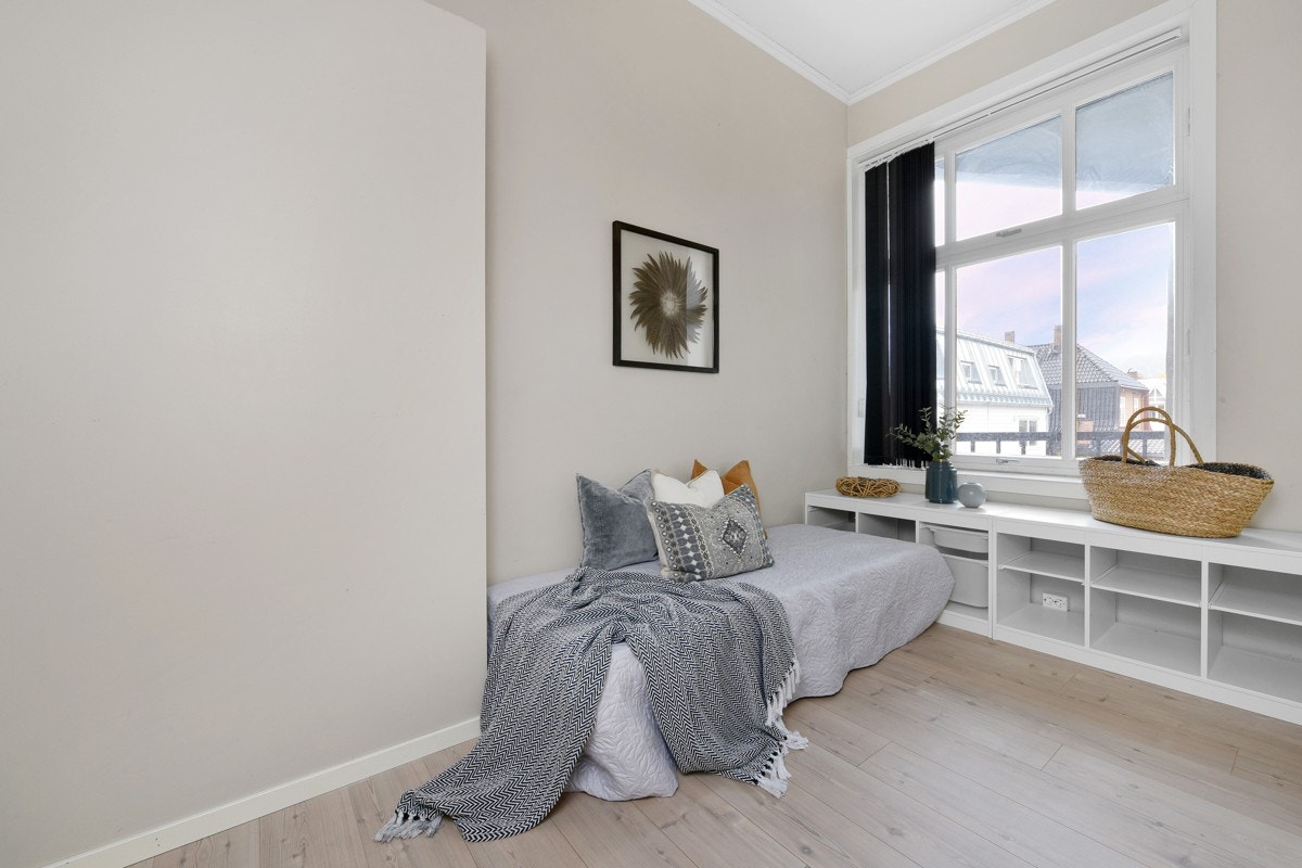 Veggene på det minste soverommet er lysmalte. Galleribilde