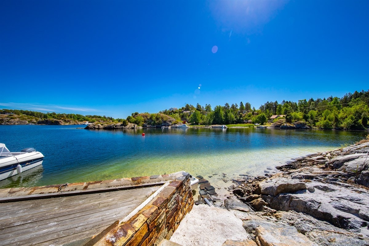 Bryggeområde med sandstrand Galleribilde