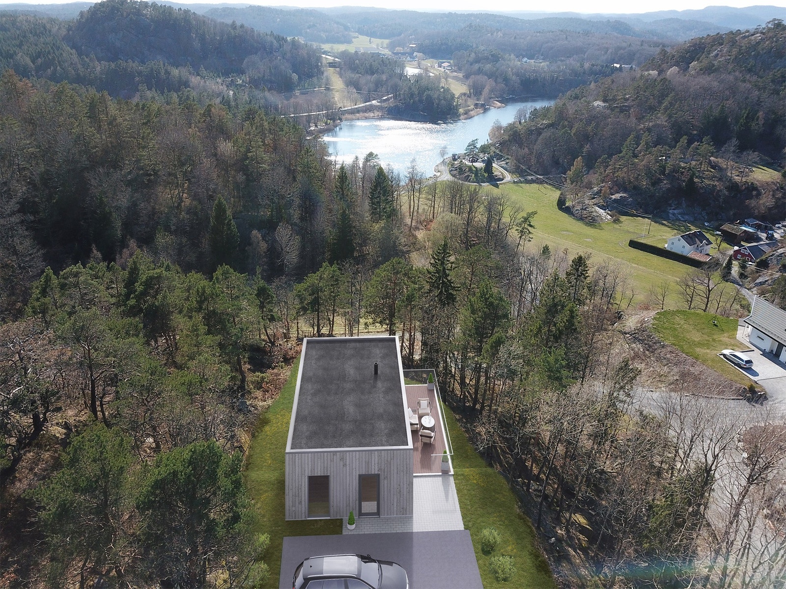 Tomten med eksempelbolig Dråpen og utsikt til Reddalskanalen Galleribilde