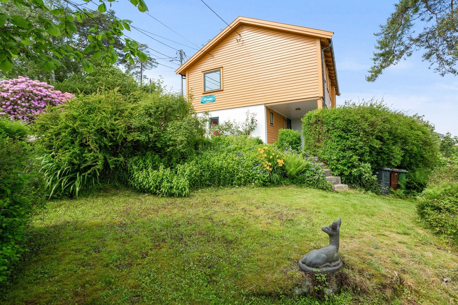 Uteområde tilhørende boligen ved innkjørsel Galleribilde