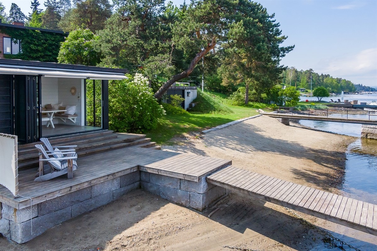 Egen strand med strandhus Galleribilde
