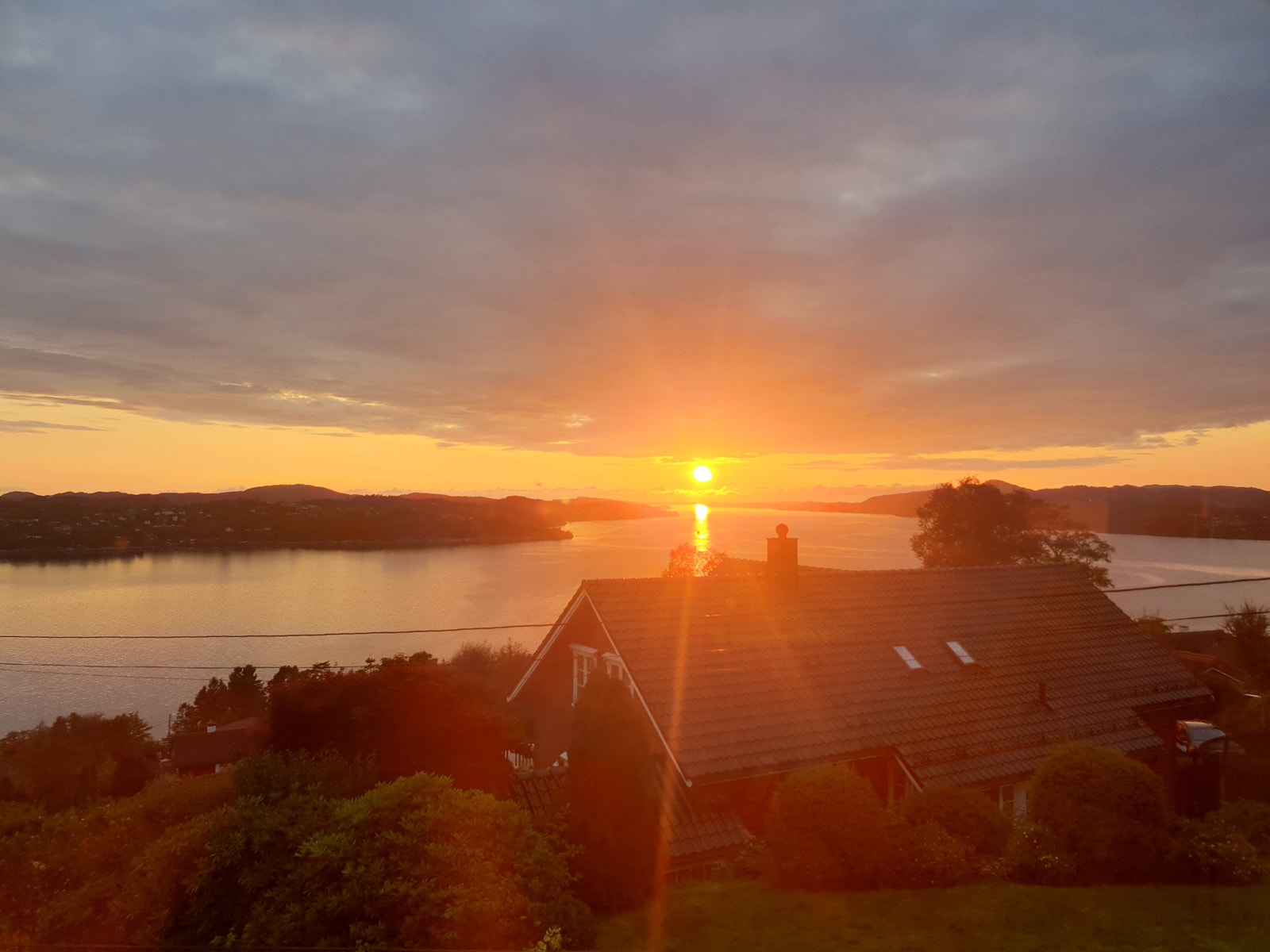 Solnedgang fra uteområde Galleribilde