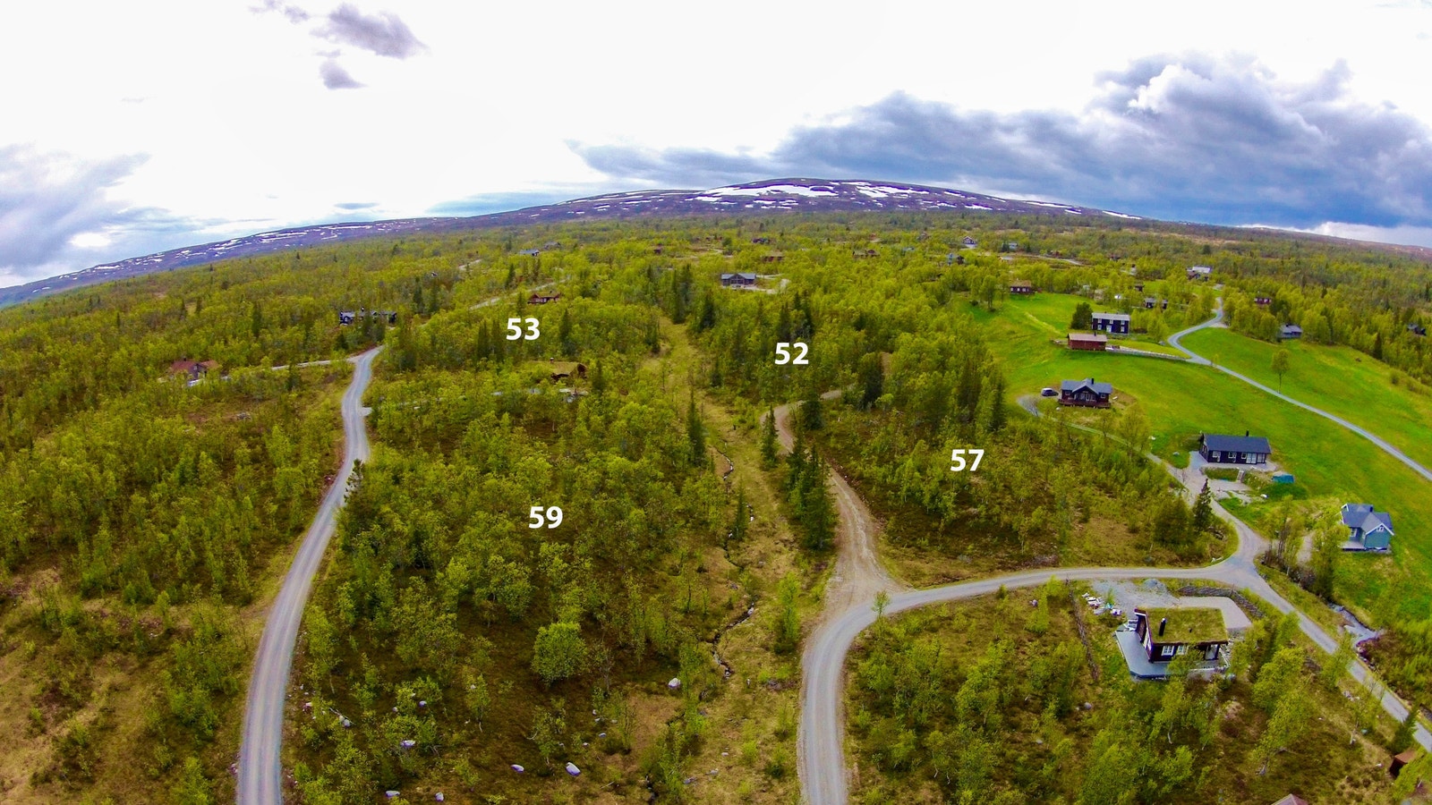 Her ser vi mot vest med tilførselsvei til grenda i ryggen Galleribilde