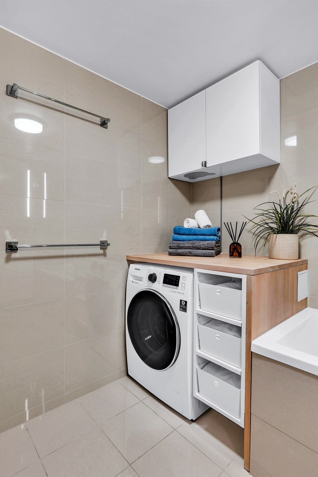 Badet har opplegg for vaskemaskin. Galleribilde