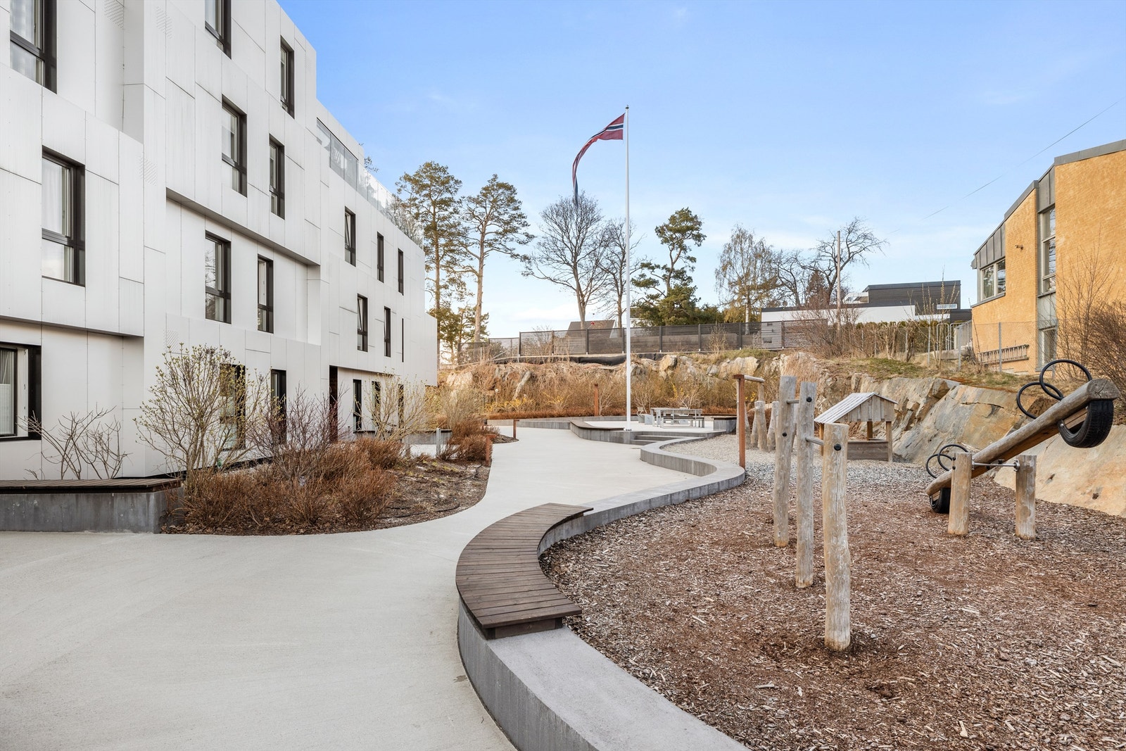 Flotte fellesarealer, skjermet bak bygget Galleribilde