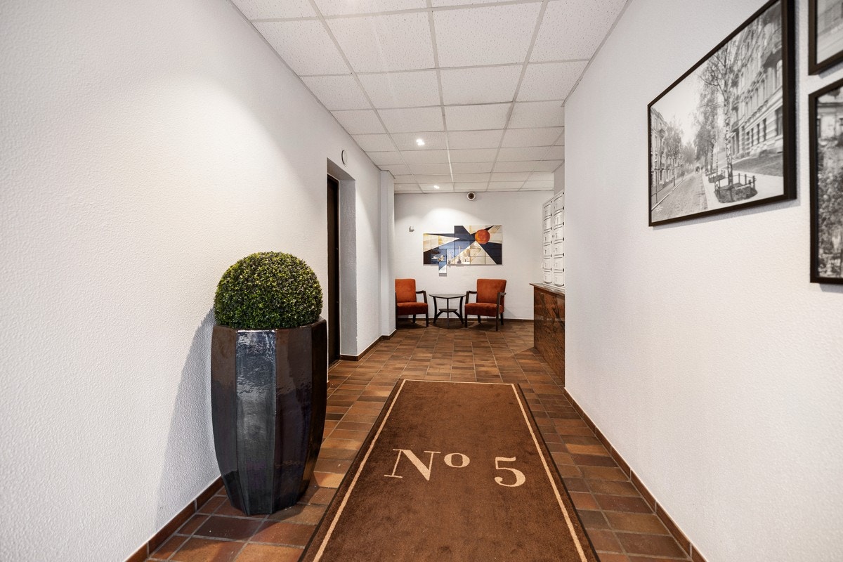 Fra garasje og felles oppgang har du enkel adkomst til 3. etasje via heis. Galleribilde