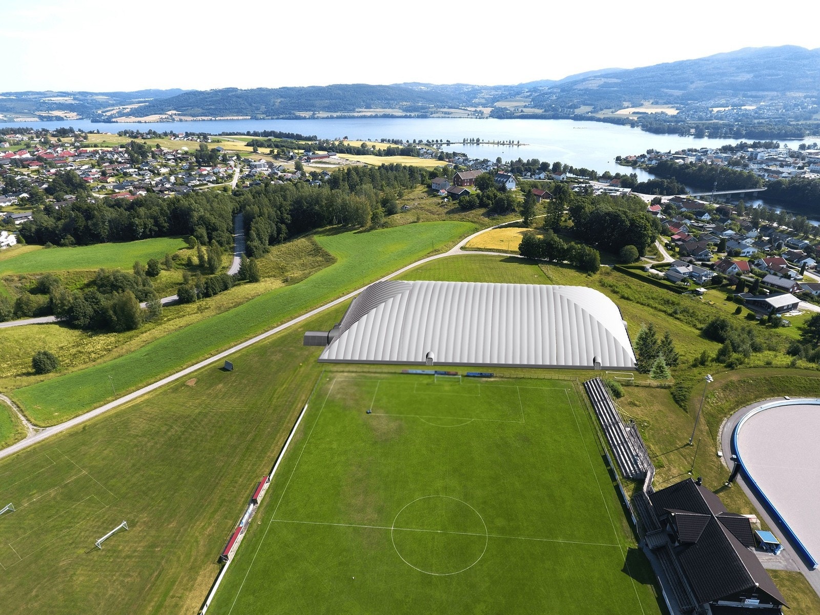 Flotte Jevnaker stadion med kunstgress, idrettshall, klatrevegger, gressbaner og skøytebane Galleribilde