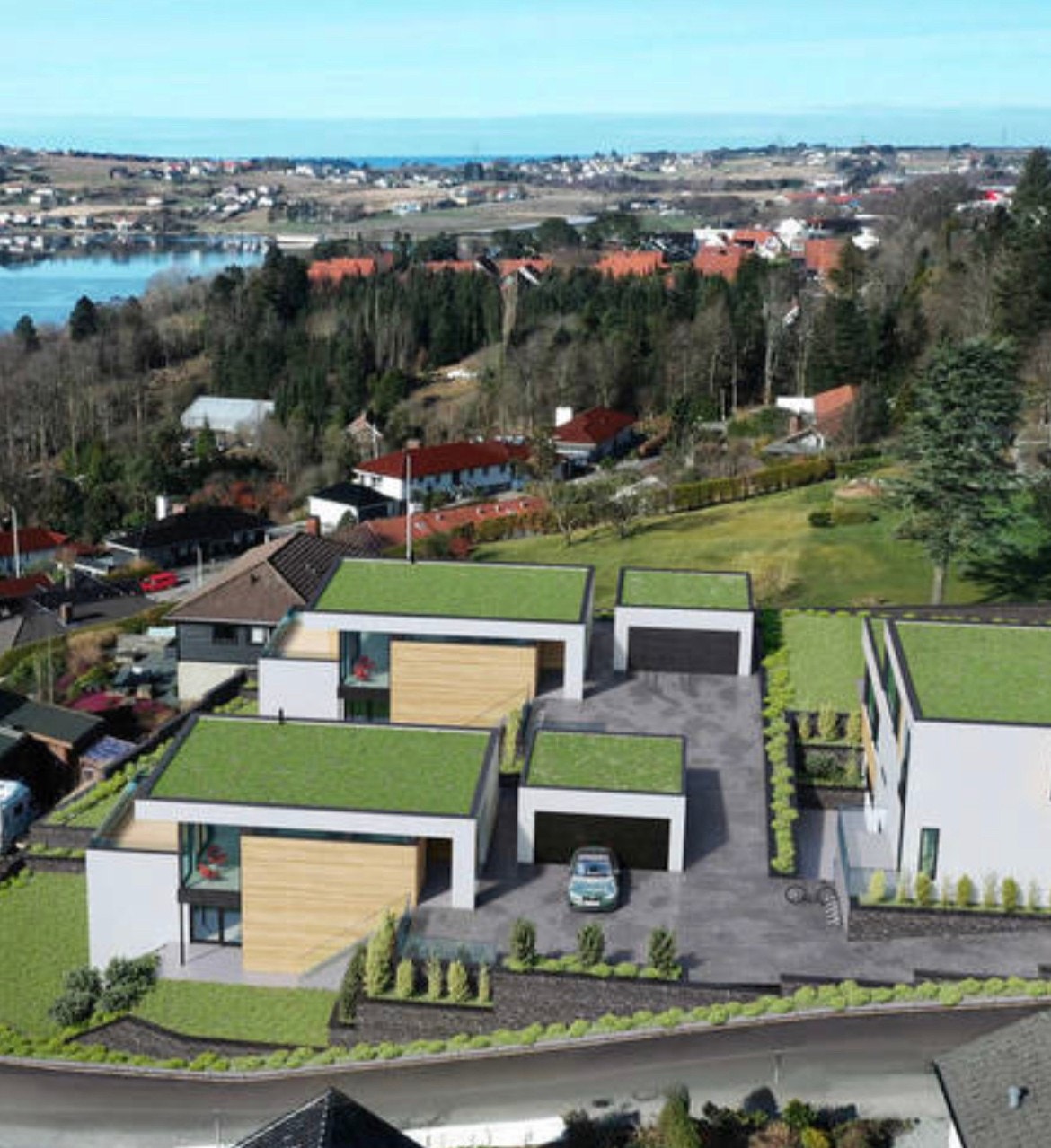 Leiligheten ligger i bygget nærmest i bildet, i nederste etasje. Store vinduer mot Hafrsfjord Galleribilde