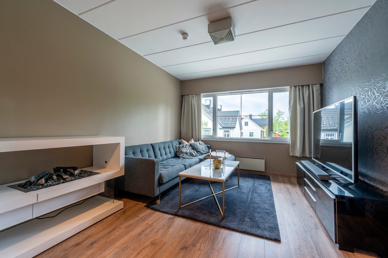 Åpen stue- og kjøkkenløsning på 21 kvm. Galleribilde