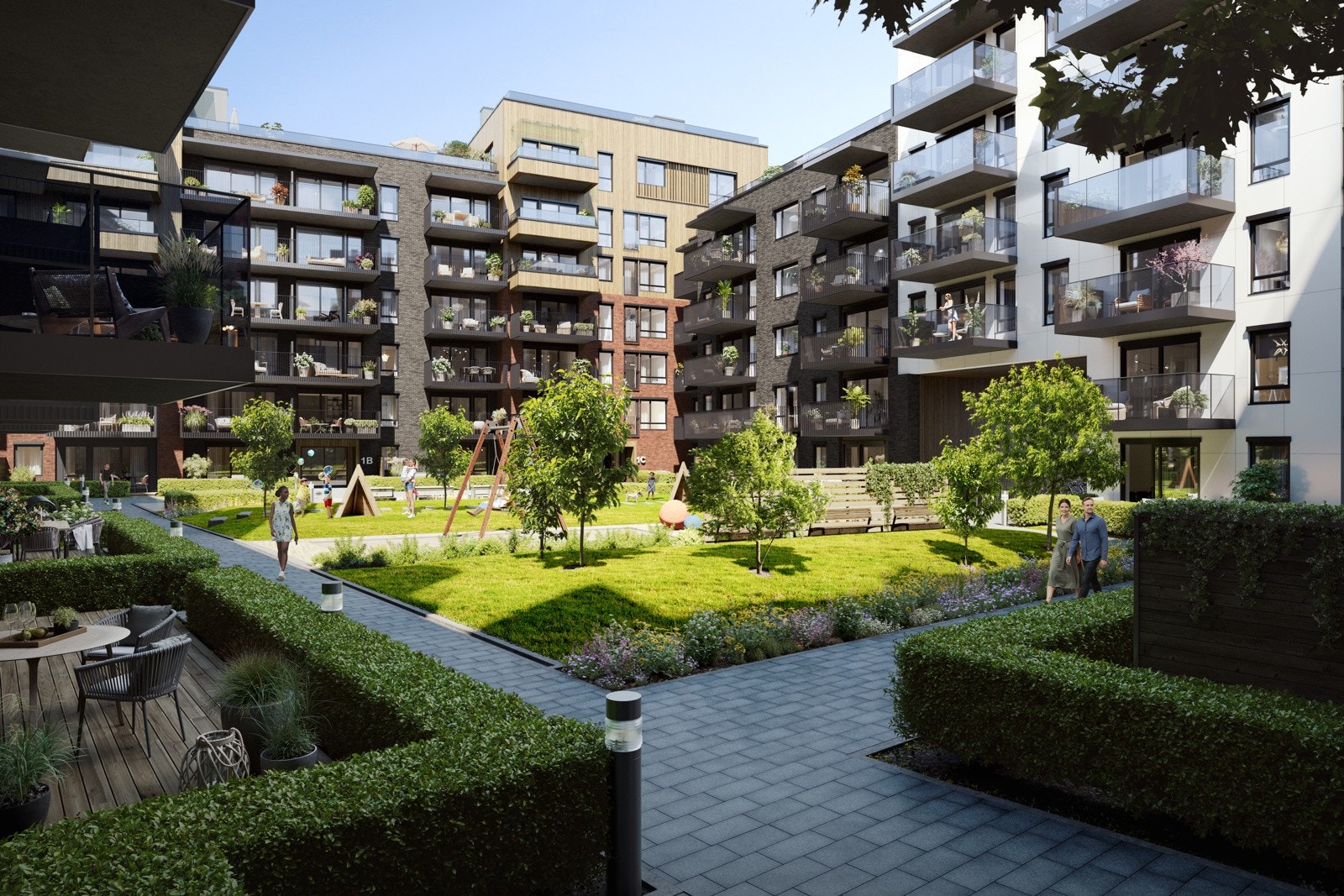 Hyggelig gårdsrom mellom byggene med sittegrupper og lekeområder Galleribilde