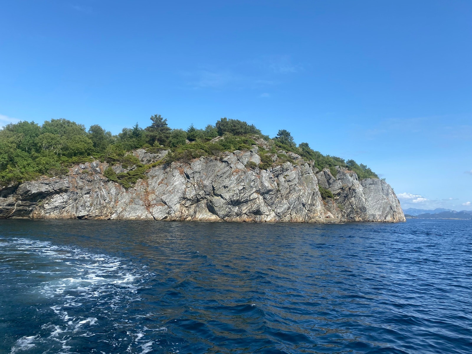 Steinsøy from the sea. Good climing places. Galleribilde