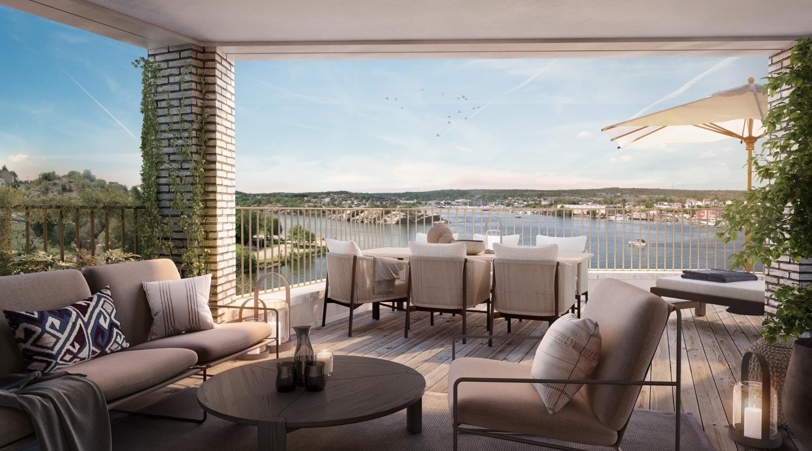 Illustrasjonsbilde av balkongen som tilhører leilighet A0501. Stor uteplass med utsikt over elven. God plass til flere sittegrupper. Galleribilde