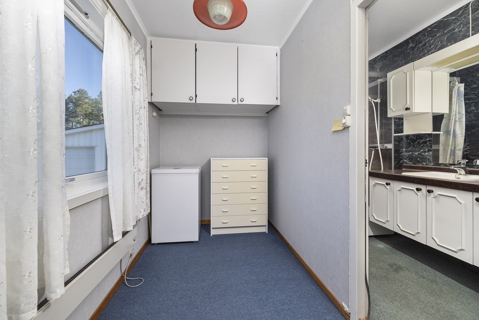 Kontoret er plassert mellom soverom og bad. Galleribilde