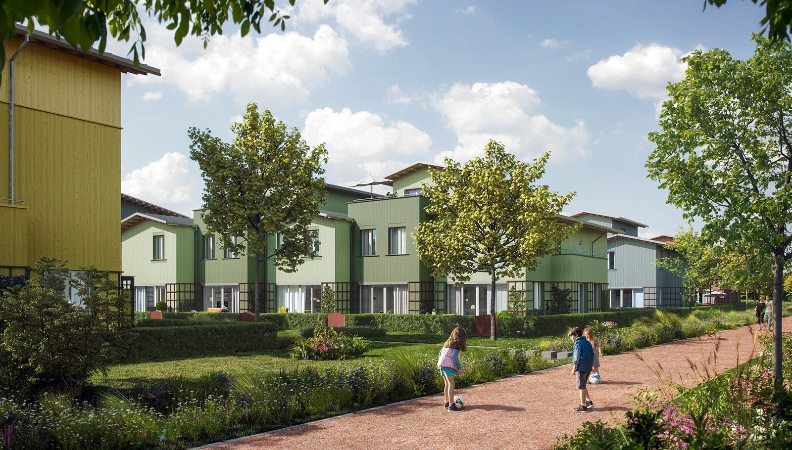 Lav og fargerik trebebyggelse med helhet og variasjon med gjennomgående karaktertrekk. Galleribilde