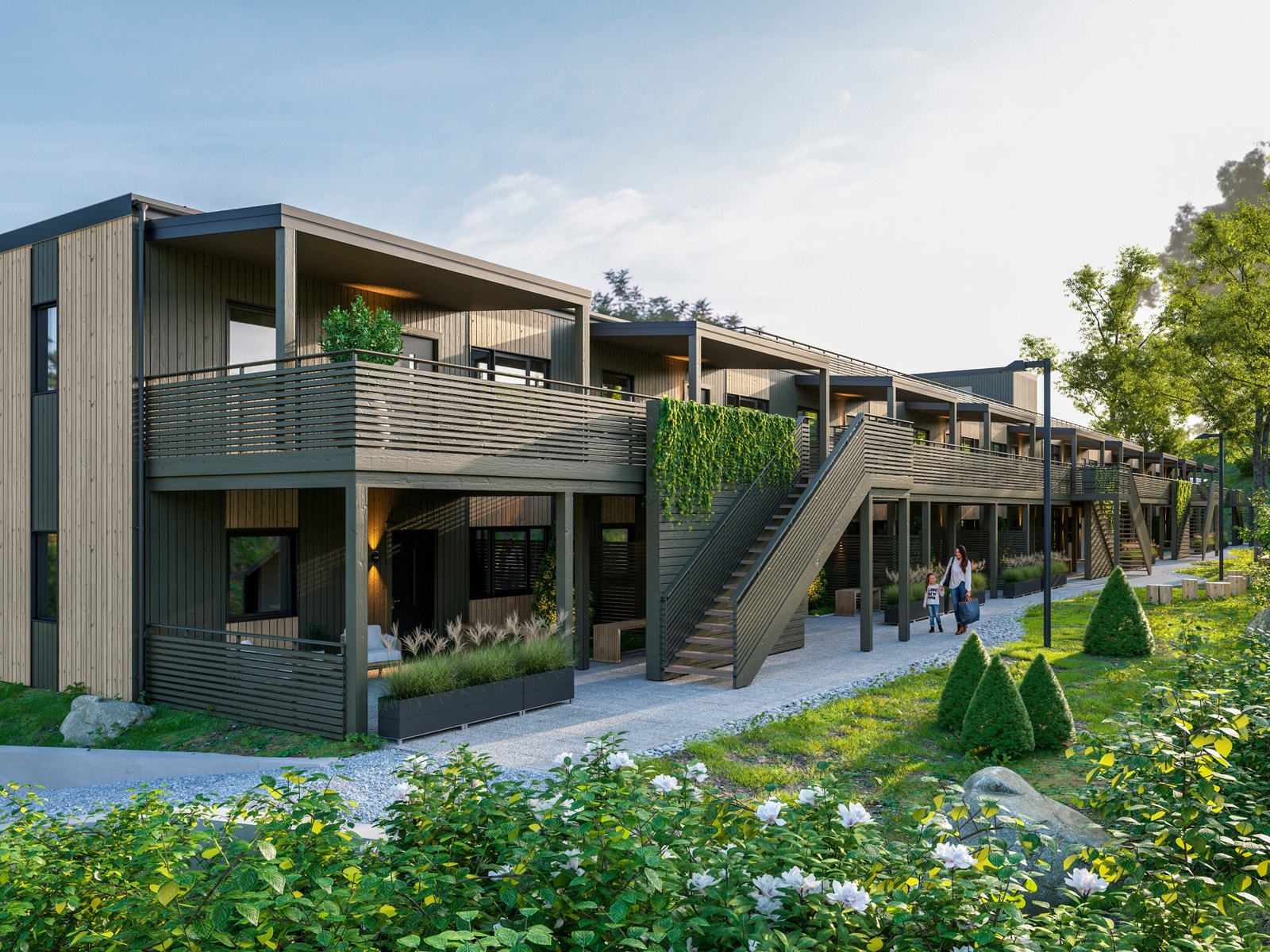 Inngangsparti med private uteplasser for hver leilighet. Galleribilde