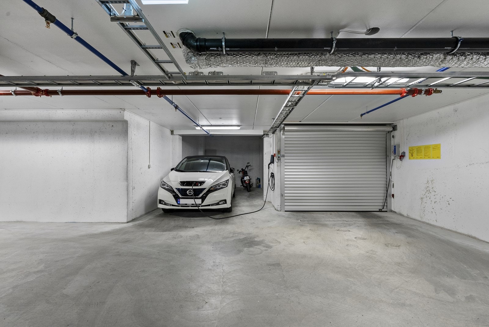 - Fast parkeringsplass i garasjeanlegg med installert elbil-lader - Galleribilde