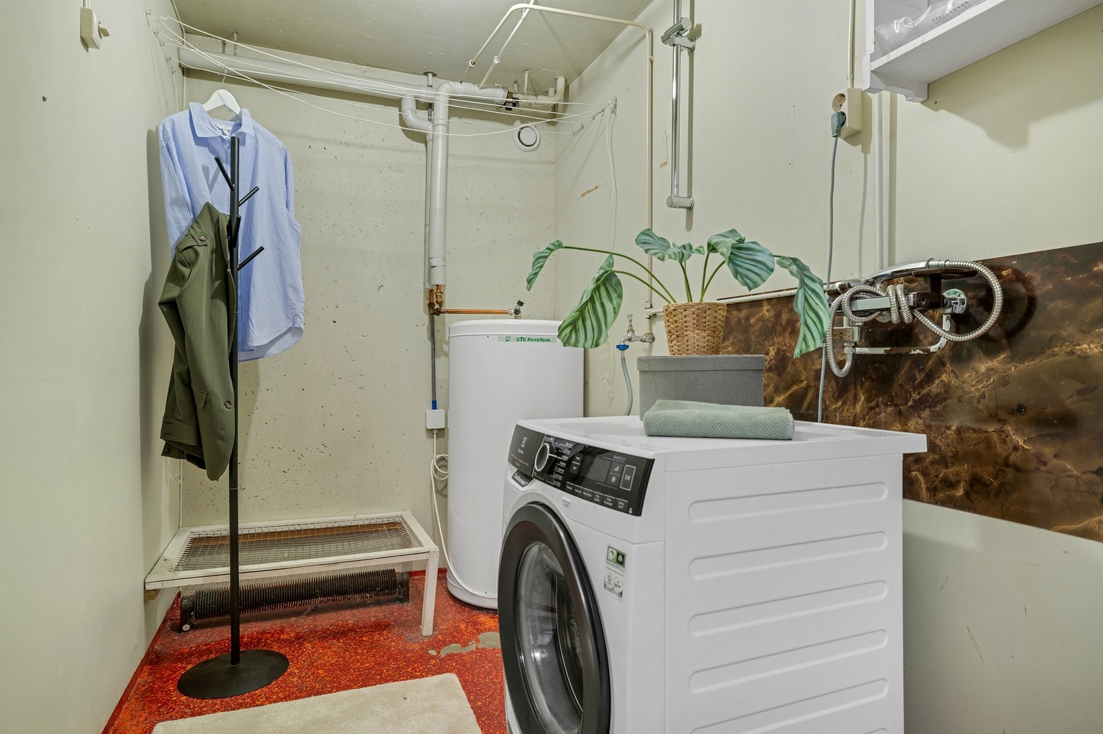 Boligen har også et eget vaskerom. Galleribilde