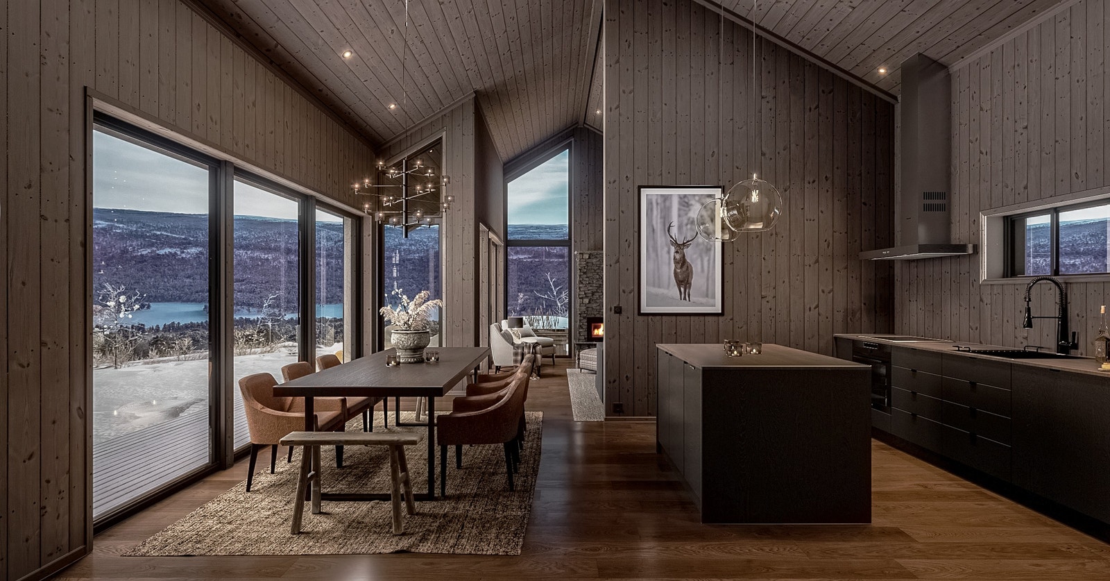 Kjøkken med øy og panoramavinduer ut mot naturen Galleribilde