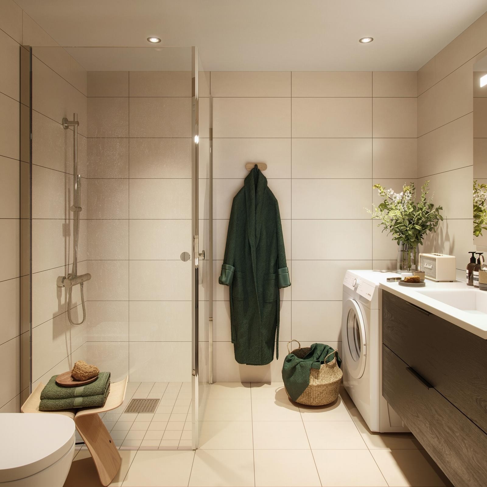 Lyst og moderne bad med sandfarget flis og sort servantskap fra HTH.* Galleribilde