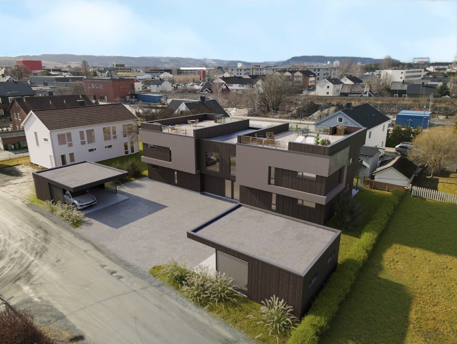 Alle leiligheter vil få egen carport med utstyrsbod i tilknytning. Asfaltert gårdsplass. Galleribilde