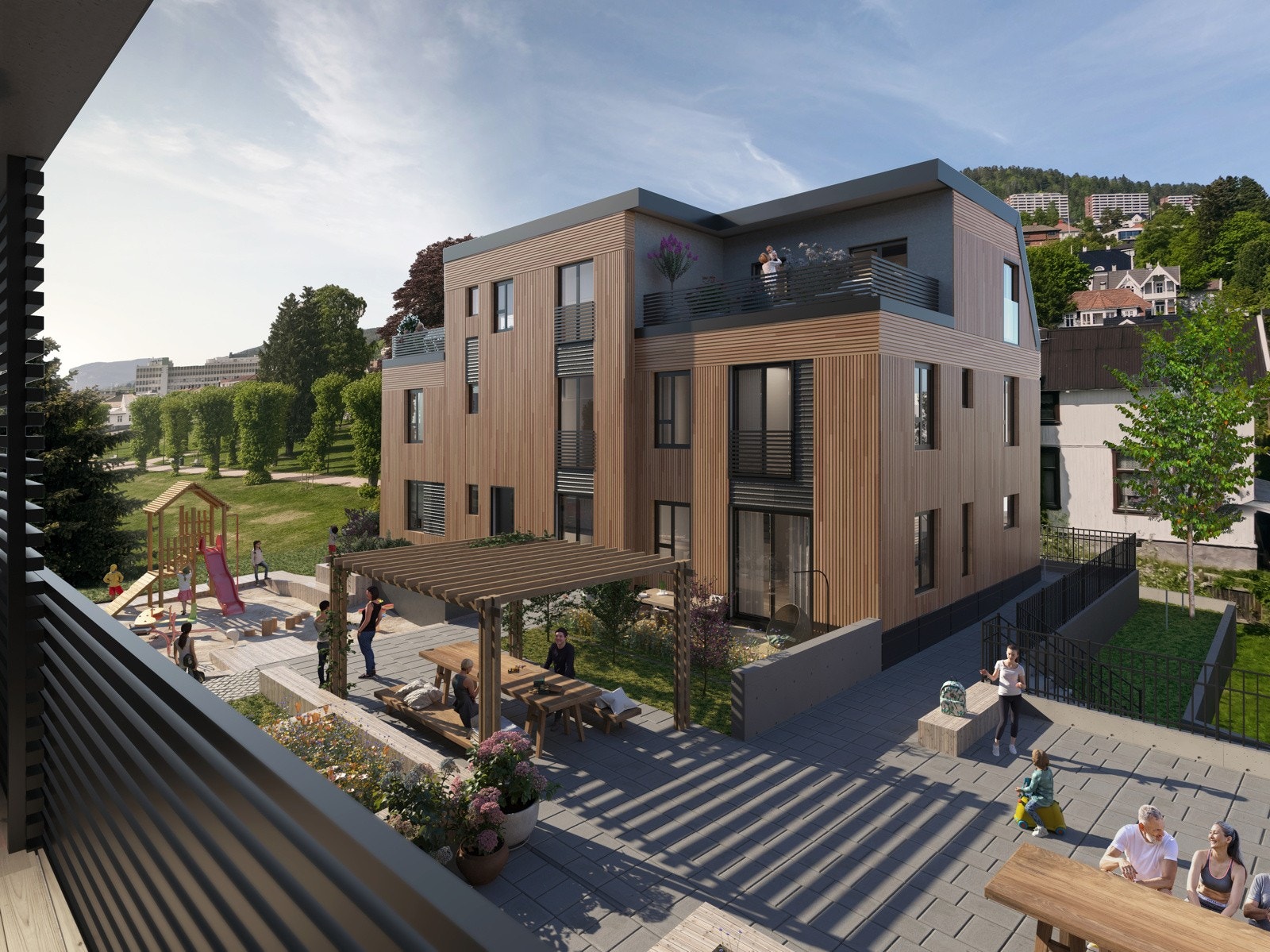 Den grønne intime bakgården mellom byggene blir beplantet med prydbusker og tilrettelagt for sittegrupper og lekeapparater til de minste. Galleribilde