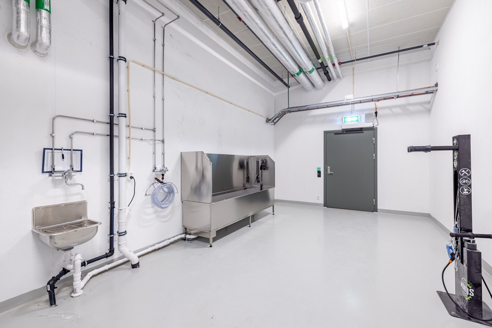 Beboerne har tilgang til eget sykkelverksted og vaskeplass. Galleribilde