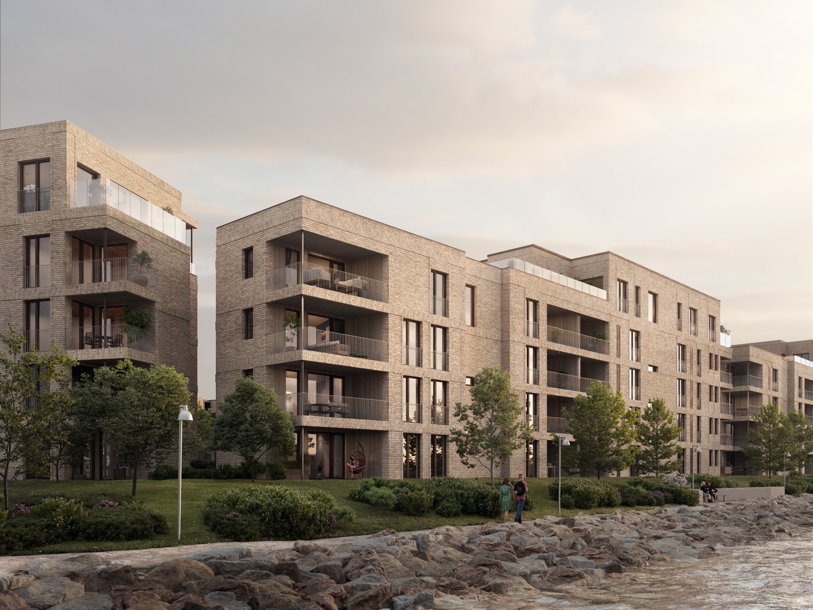 Her ser vi i hovedsak Fjordtunet 2, og hjørnet av Fjordtunet 1 til venstre. Delikat teglsteinsfasade og sedertre inne i balkongene. Bildet er en 3D illustrasjon og kan inneha elementer/løsninger som ikke er standardleveranse. Endringer vil forekomme. Galleribilde