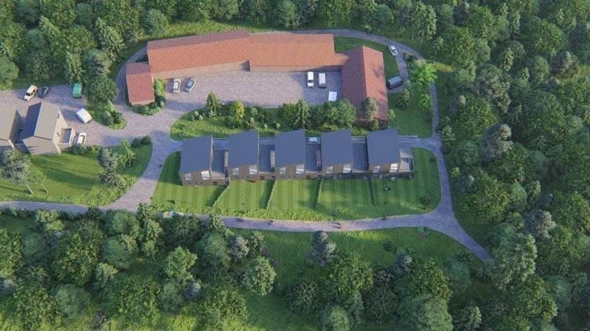 5 seksjonerte tomter med rammetillatelse for oppføring av 5 eneboliger. Droneillustrasjon - avvik vil forekomme. Galleribilde