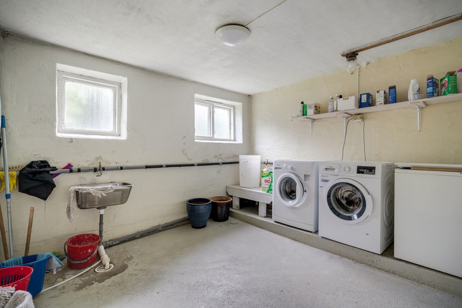 Felles vaskekjeller. Her har hver leilighet opplegg for egen vaskemaskin. Galleribilde