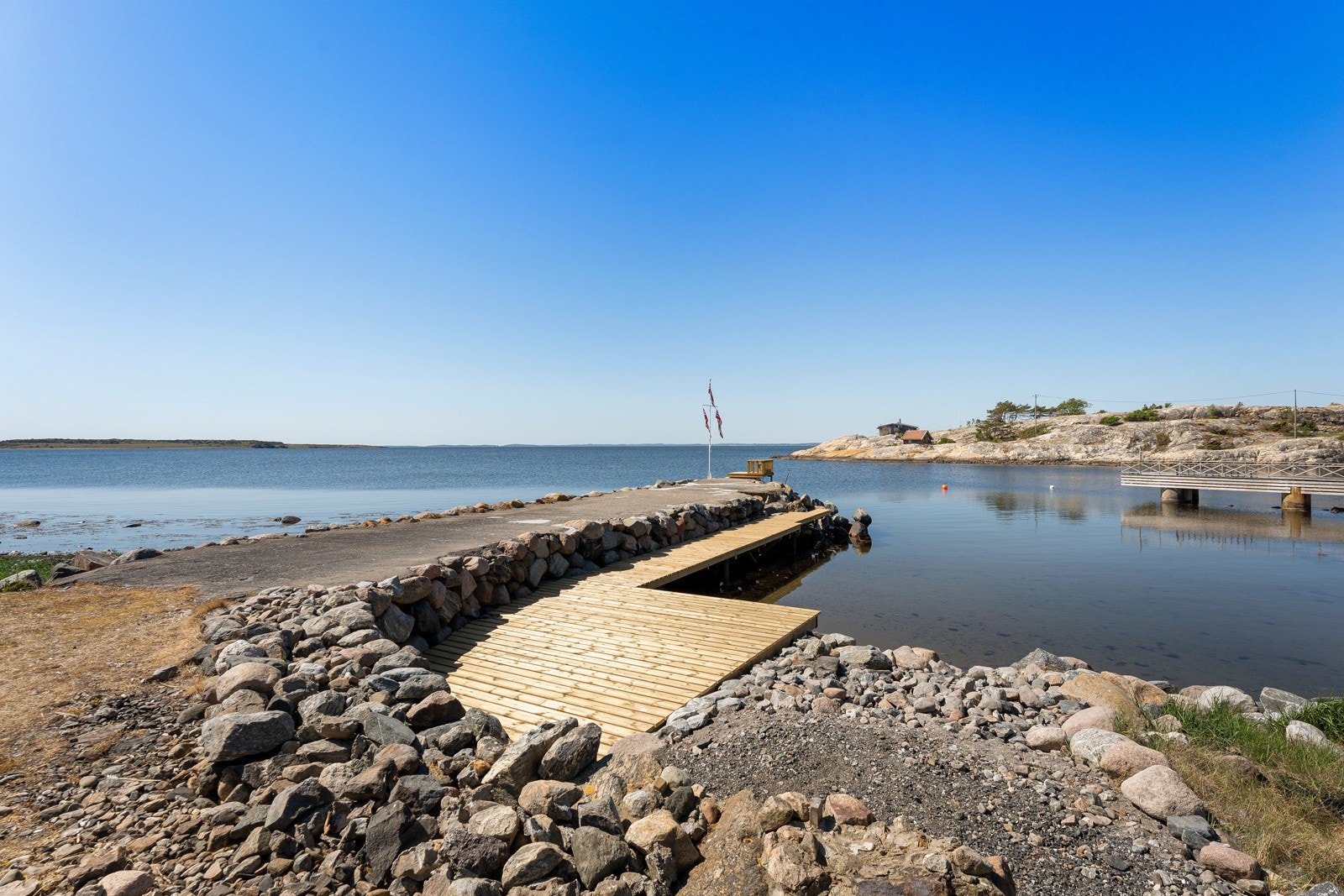 Egen brygge/molo med sandstrand Galleribilde