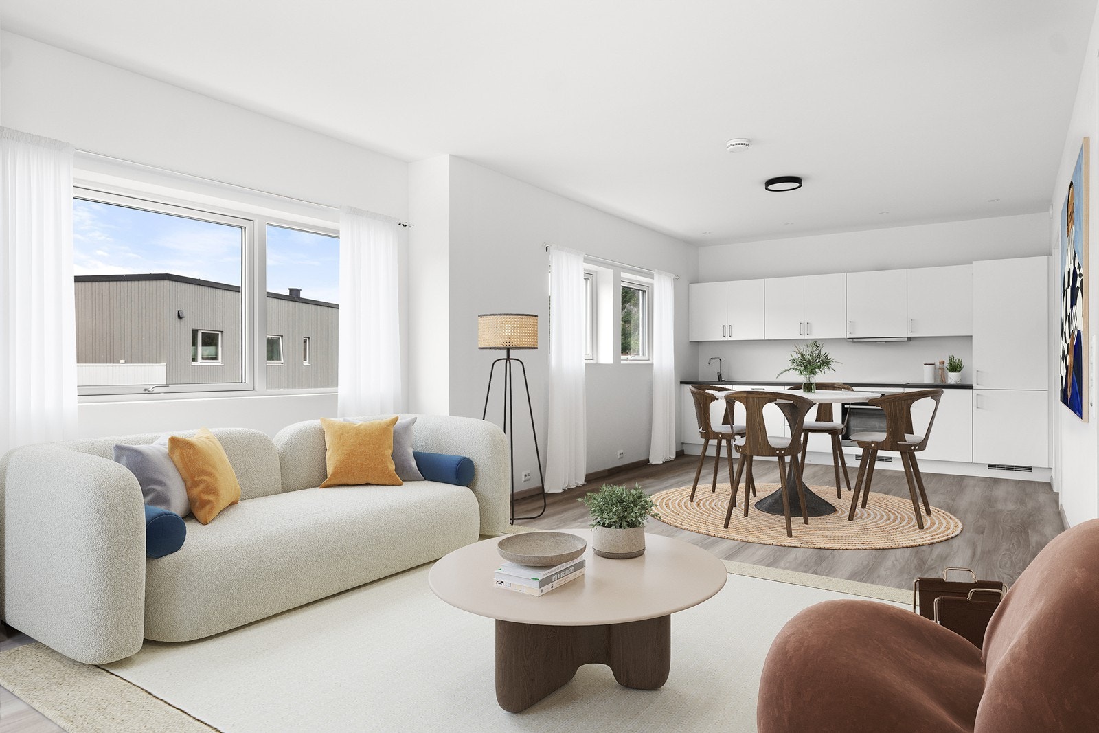 Åpen løsning mellom stue og kjøkken. Her er det plass til både sittegruppe og spisegruppe. Galleribilde