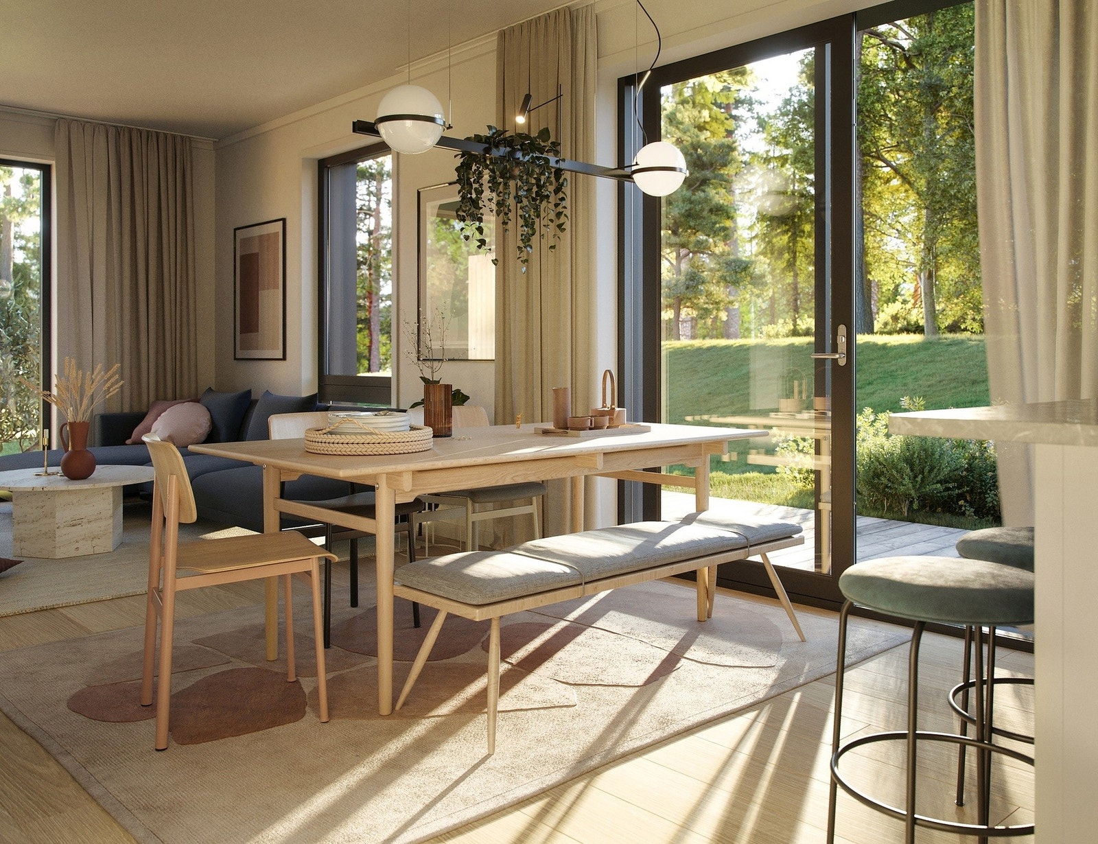 I det du kommer inn, kan du se gjennom hele boligen og ut på den andre siden. Skyvedørene ut til terrassen åpner videre ut i friluft. Galleribilde