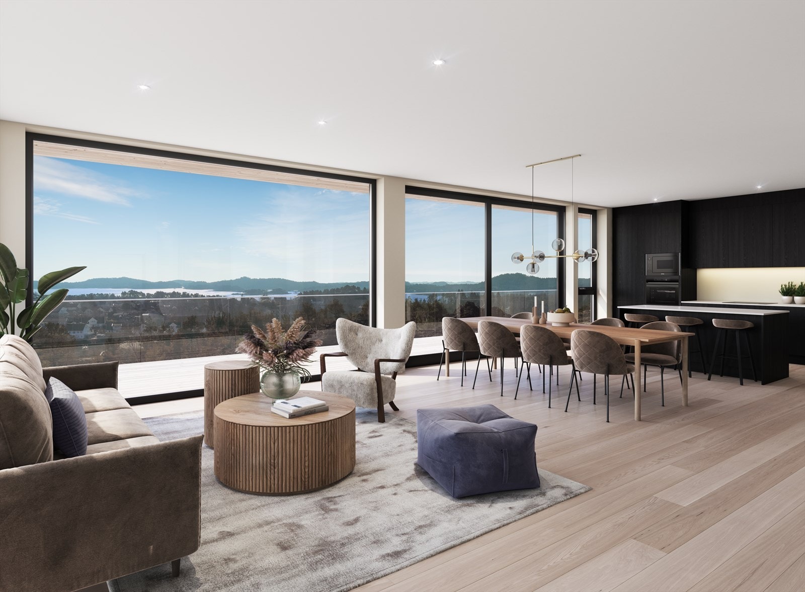 Fra stua er det store vindusflater som gir rommet mye lys og fantastisk sjøutsikt! Galleribilde