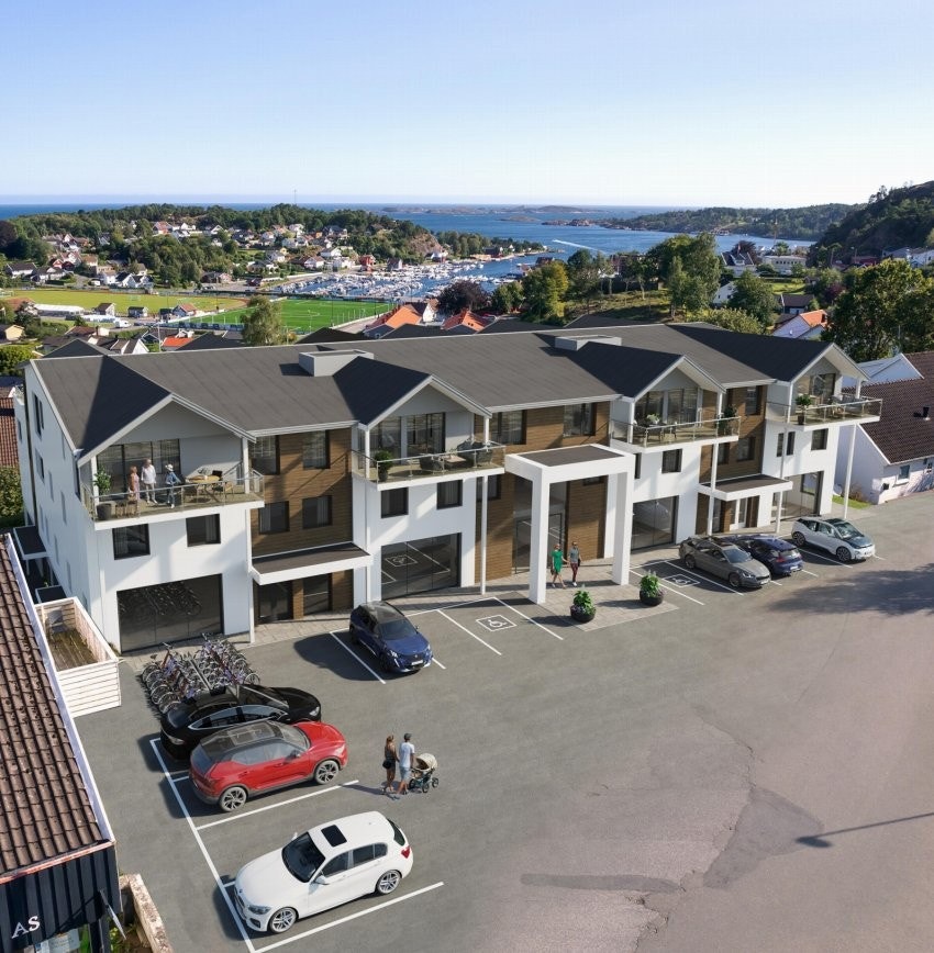 Sørmegleren næring av gleden av å presentere for salg bygg under oppføring med butikk/kontorlokaler i seksjoner til salgs. Galleribilde