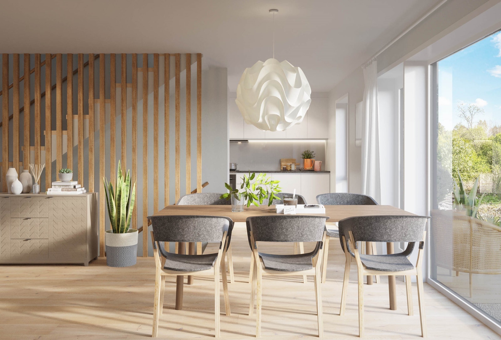 Stue og kjøkken ligger i delvis åpen løsning i første etasje - et lyst og innbydende rom på ca. 30 kvm. Galleribilde