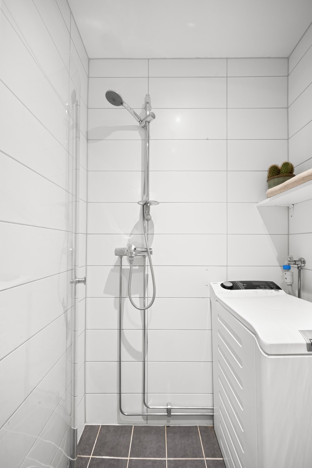 Badet har opplegg for vaskemaskin. Galleribilde