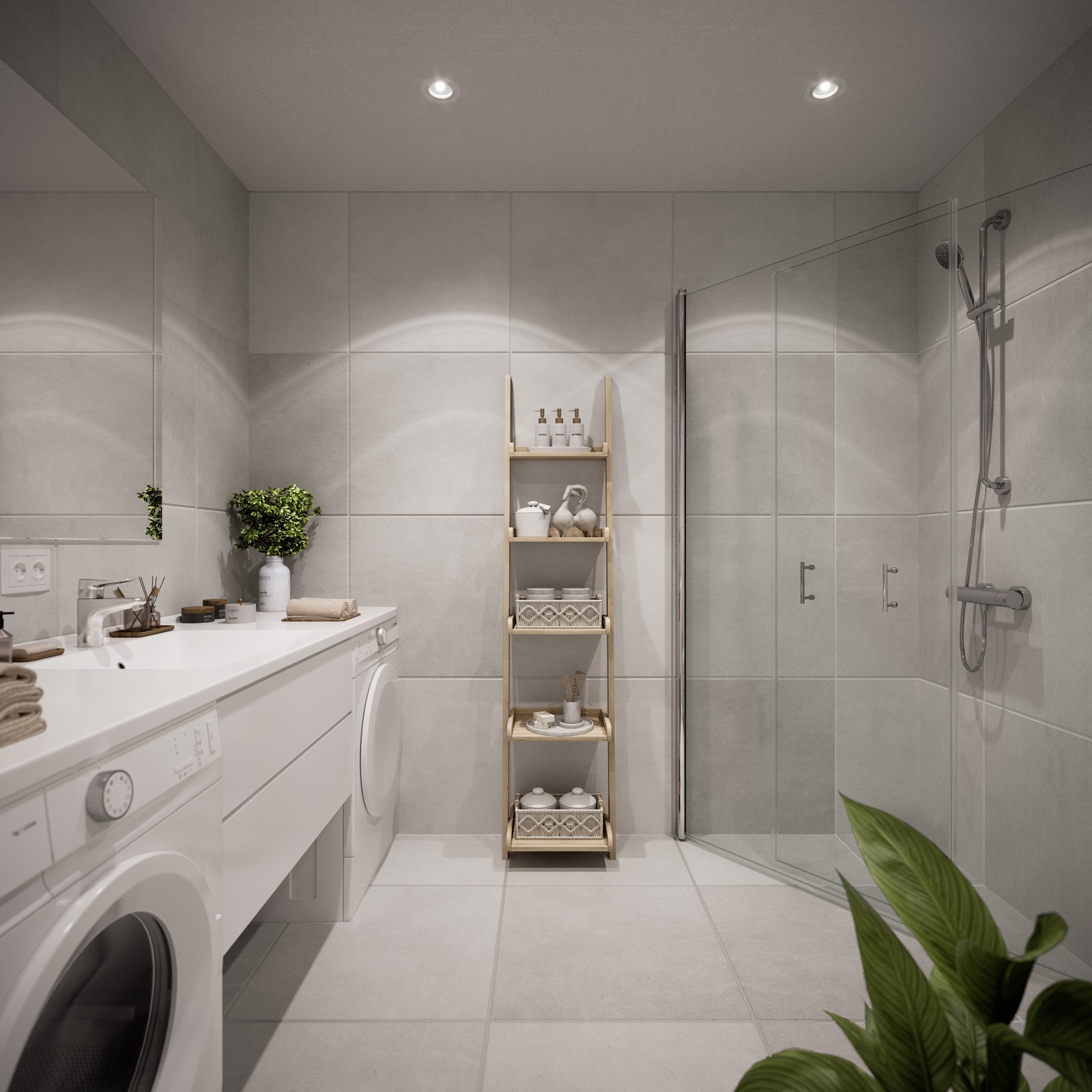 Stort hovedbad med delikate lysgrå fliser, lyse overflater, opplegg for vaskemaskin, downlights i tak og vegghengt toalett. Varmekabler i gulv og stikkontakter i baderomsinnredning. Leiligheten har også en ekstra WC som gir fleksibilitet i hverdagen. Galleribilde